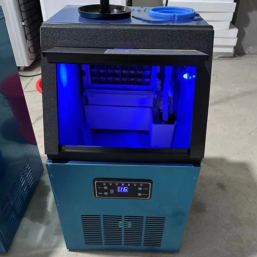 IM-30 countertop ice cube machine, cube grid lit inside the bin